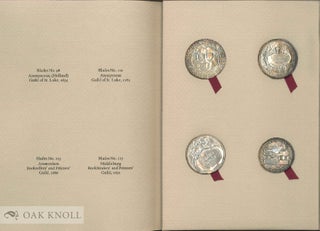 RARITIES OF NUMISMATA TYPOGRAPHICA, FOUR EXAMPLES OF EARLY DUTCH PRINTER'S BOOKBINDERS' & BOOKSELLERS' GUILD MEDALS, CAST IN STERLING SILVER FROM ORIGINAL SPECIMENS.